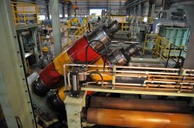 当社製品「自動刃組スリッター」