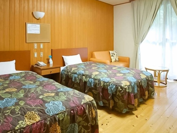 都会の喧騒を忘れくつろげる客室